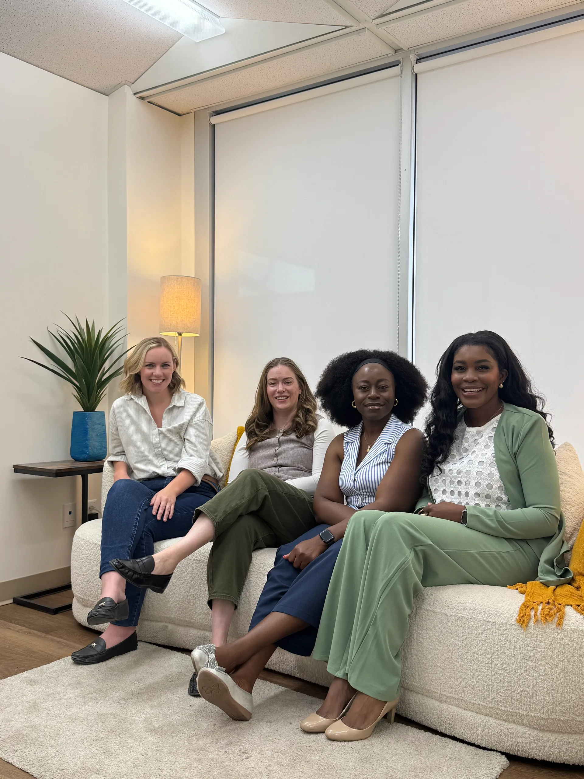 The Healing Journey Collective team — Simone, Jessica, Idy and Ashlea — together in our Calgary office