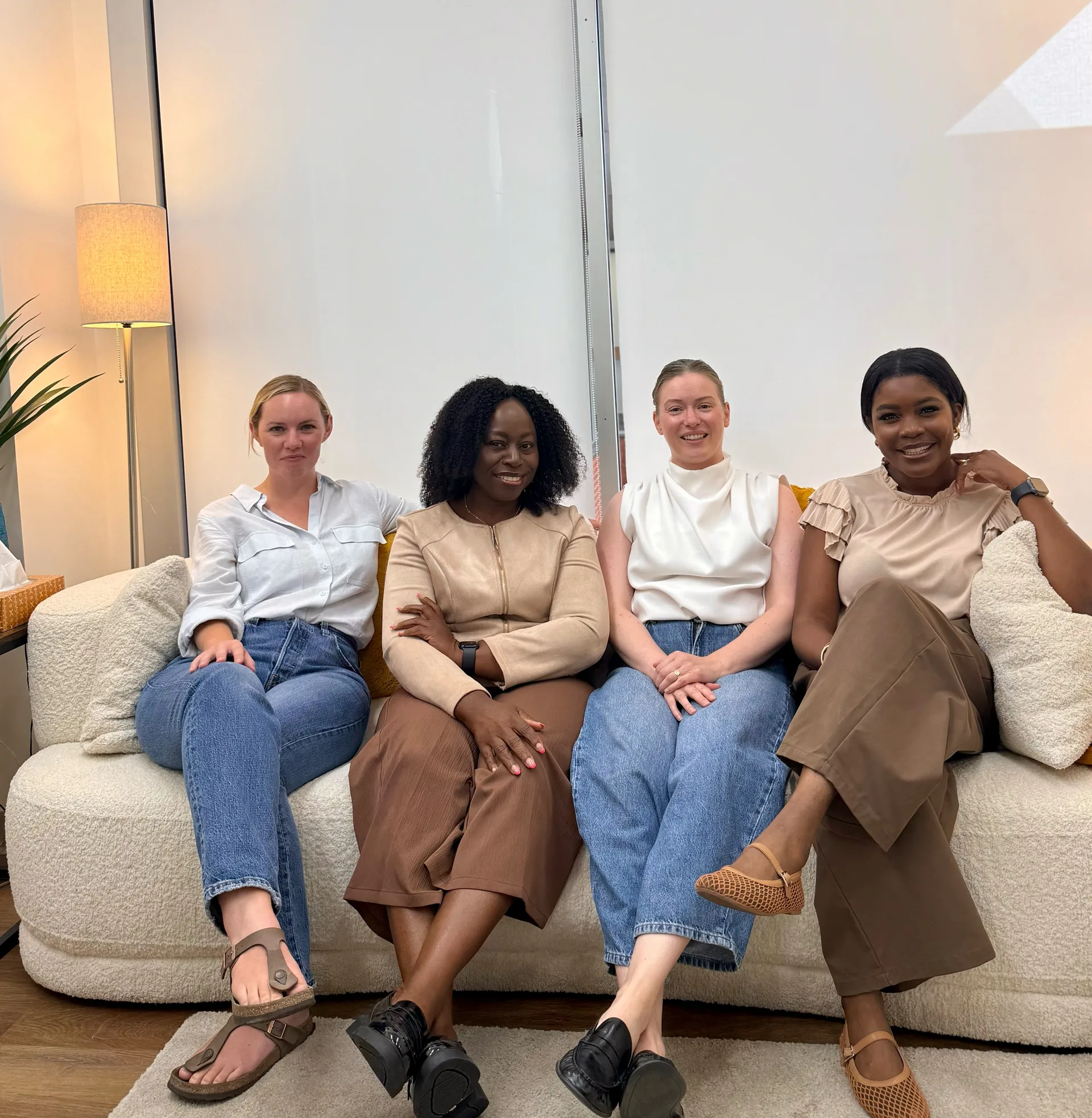 The Healing Journey Collective team — Ashlea Tait, Idy Akpan, Jessica Parker and Simone Swenson — in our Calgary office