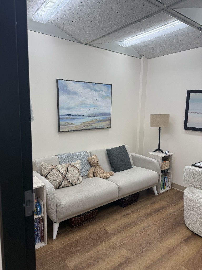 A warm therapy room with comfortable seating